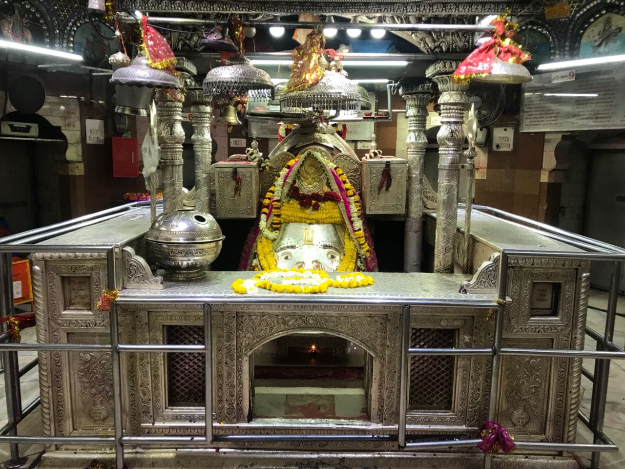 The svayambhu pindi of Devi Kalka on her silver-clad altar under a silver chhatra, Kalkaji Mandir, Delhi